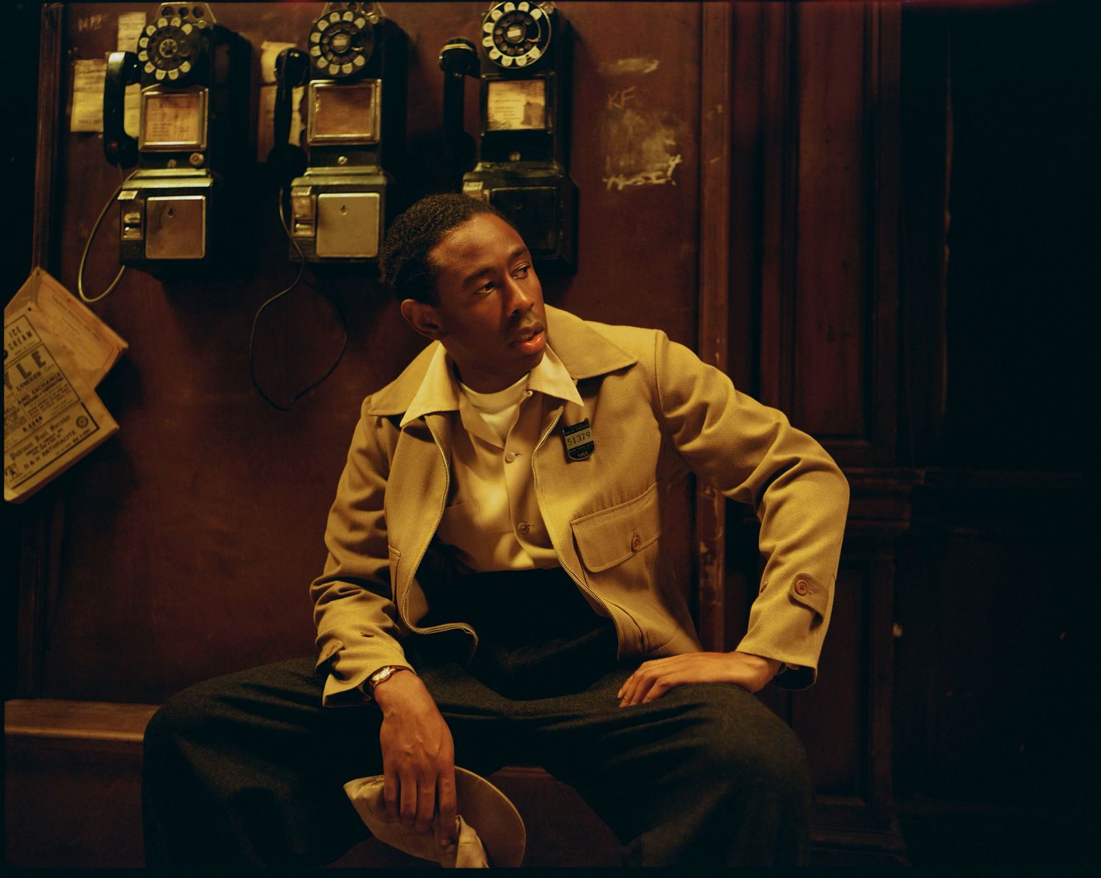 Image may contain Tyler The Creator Person Sitting Face Head Photography Portrait Adult Clothing and Coat